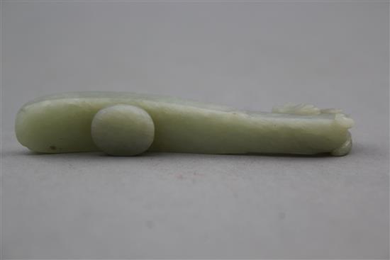 A Chinese pale celadon jade belt hook, 19th century, 9.8cm.